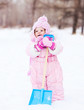 baby with a toy spade