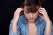 Woman suffering from a throbbing headache