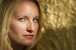 Blonde Caucasian Woman on Gold Background