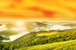 Flaring sun, golden sky and cloudy Carpathian Mountains Flaring sun, golden sky and cloudy Carpathian Mountains