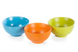 Three colored ceramic cups on white background