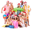Group people holding beach accessories.