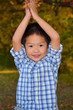 Happy Asian Boy Playing With Autumn Leaves Happy Asian Boy Playing With Autumn Leaves