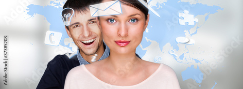 Foto: A business people with icons floating around their head. Portrai A business people with icons floating around their head. Portrai