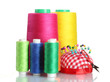 Bobbins of thread with colored pinheads in pin-cushion isolated