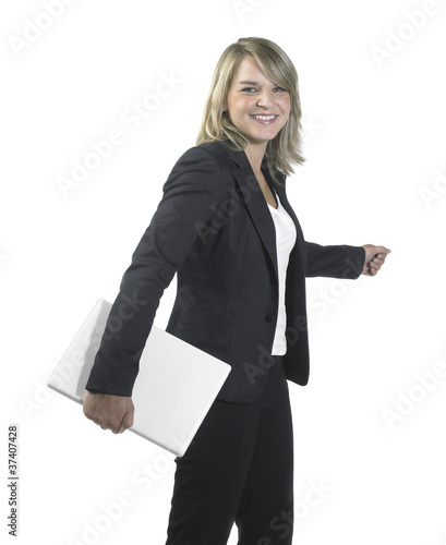 Foto: young business woman holding a laptop young business woman holding a laptop
