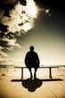 Photo: Young Man In Silhouette Sitting In The Sun Young Man In Silhouette Sitting In The Sun