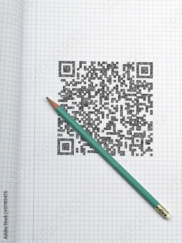 Photo: Pen and QR CODE on graph paper Pen and QR CODE on graph paper