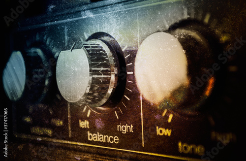 Photo: Old grunge amplifier close up Old grunge amplifier close up