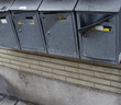 vandalized mail boxes in a row