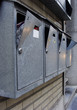 vandalized mail boxes in a row