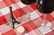 Souvenir Eiffel tower, a pair of wineglasses on the table