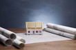 Construction plans and blueprints on wooden table