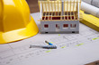Construction plans and blueprints on wooden table