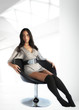 Beautiful woman / model relaxing on a chair