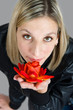 Portrait of the girl with a rose in hand
