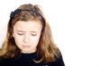 Girl looking sad against white background