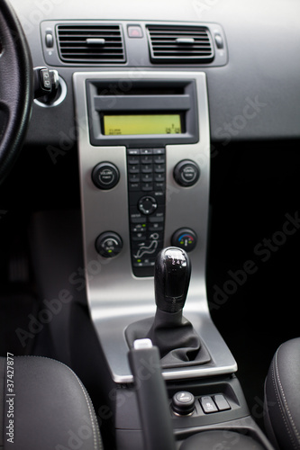 Photo: Modern car interior (shallow DOF - selective focus; color toned Modern car interior (shallow DOF - selective focus; color toned