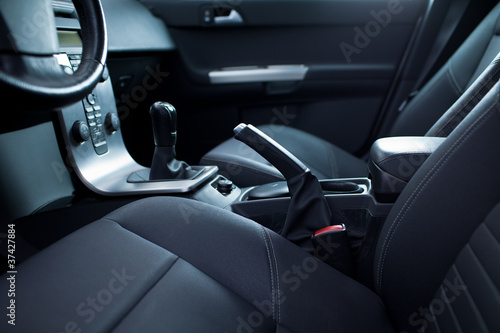 Photo: Modern car interior (shallow DOF - selective focus; color toned Modern car interior (shallow DOF - selective focus; color toned