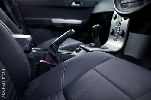 Photo: Modern car interior (shallow DOF - selective focus; color toned Modern car interior (shallow DOF - selective focus; color toned