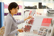 girl is buying lipstick
