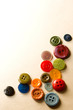A pile of many-coloured buttons