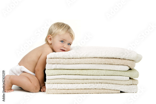 Photo: Baby girl resting head on towels Baby girl resting head on towels