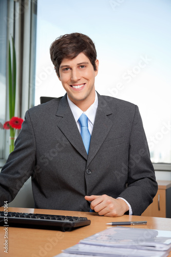 Photo: Male Manager Smiling Male Manager Smiling