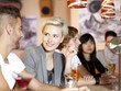 Young couple sitting at the bar with friends