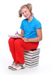 Cute schoolgirl with book.