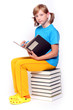 Cute schoolgirl with book.