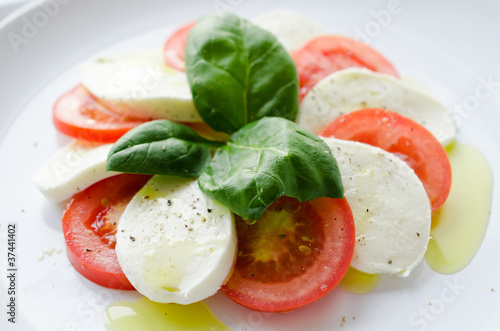 Photo: Italian salad with tomatos and mozarella cheese Italian salad with tomatos and mozarella cheese
