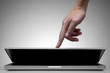 Photo: Hand closing laptop on white Hand closing laptop on white