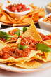 Nachos, corn chips with chili sauce