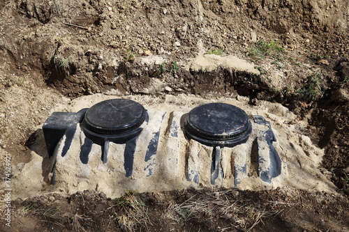 Photo: New Residential Septic Tank Installation With Copyspace. New Residential Septic Tank Installation With Copyspace.