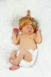 Newborn Baby Sleeping with knitted Hat on.