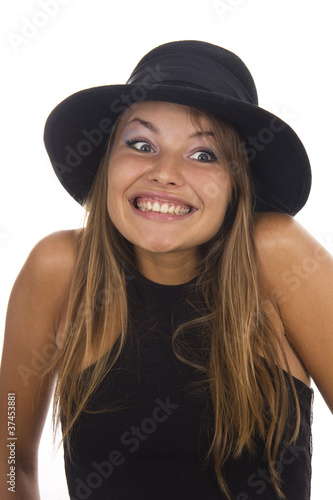 Photo: Young woman in a black hat on a white background Young woman in a black hat on a white background