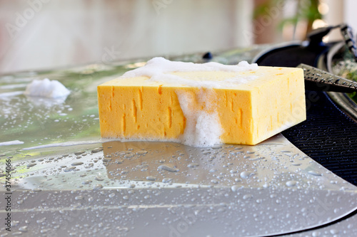 Photo: Wash car with sponge and shampoo Wash car with sponge and shampoo