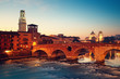 Ponte Pietra and the River Adige at night..