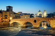 Ponte Pietra and the River Adige at night..