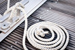 Photo: Mooring rope with a knotted end tied around a cleat. Mooring rope with a knotted end tied around a cleat.