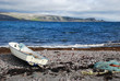 Lonaly boat at Barebtz sea cost close to abandoned fishing villa Lonaly boat at Barebtz sea cost close to abandoned fishing villa
