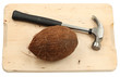 Coconut fruit and a hammer