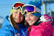 Portrait of two beautiful girls in ski suits