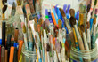 A lot of brushes for painting are in the banks A lot of brushes for painting are in the banks