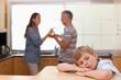 Foto: Sad little boy hearing his parents arguing Sad little boy hearing his parents arguing