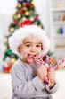 Boy eating twisted candy