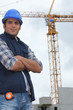 Construction worker in front of a crane