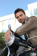 Man sitting on scooter