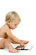 Photo: Baby girl with tablet on white background Baby girl with tablet on white background